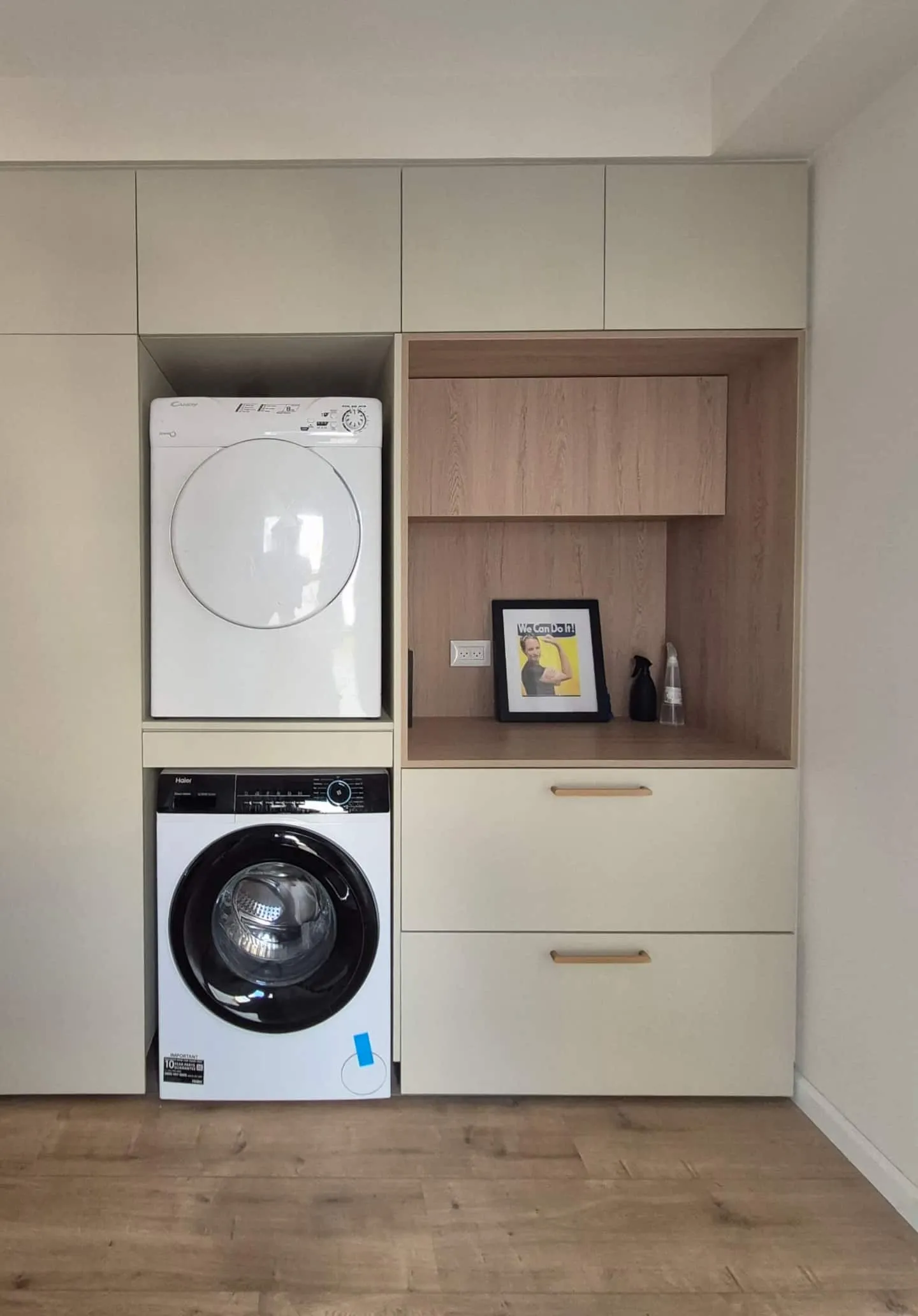 Stacked washer and dryer built into cabinetry.