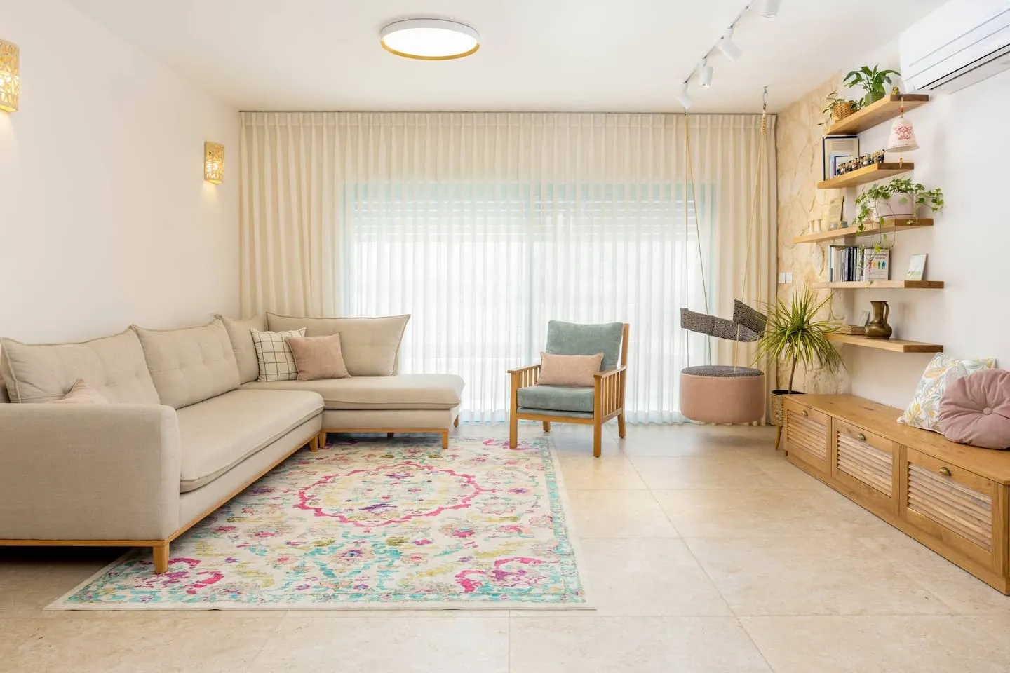 Bedroom with a double bed, white linens, and a wall-mounted air conditioner.